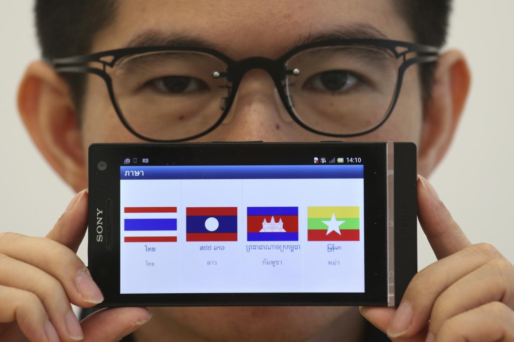 Developer Ken Law shows off the anti-slavery app. Photo: David Wong