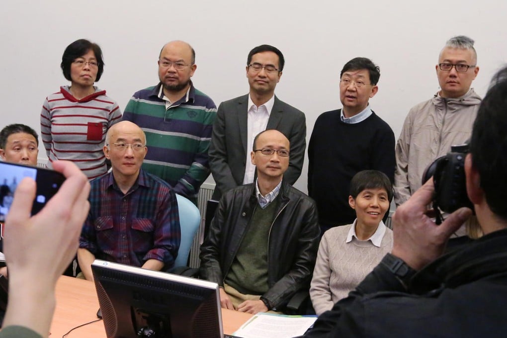 Fighting for academic freedom: the campaign group, including Joseph Chan, sitting third right, meet the press. Photo: Felix Wong