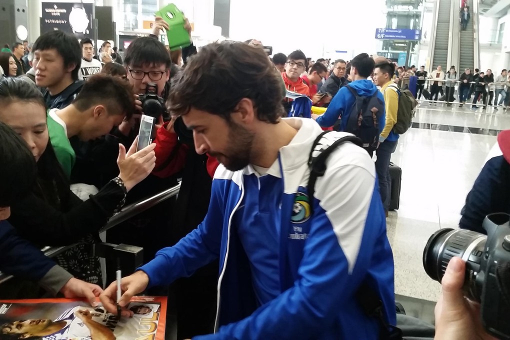 New York Cosmos star Raul is mobbed by fans on the team's arrival. Photo: SCMP Pictures