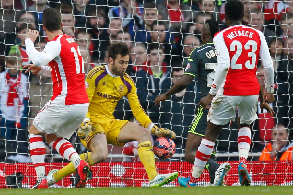Arsenal striker Olivier Giroud (left) scores the opening goal against Middlesbrough. Photo: AFP