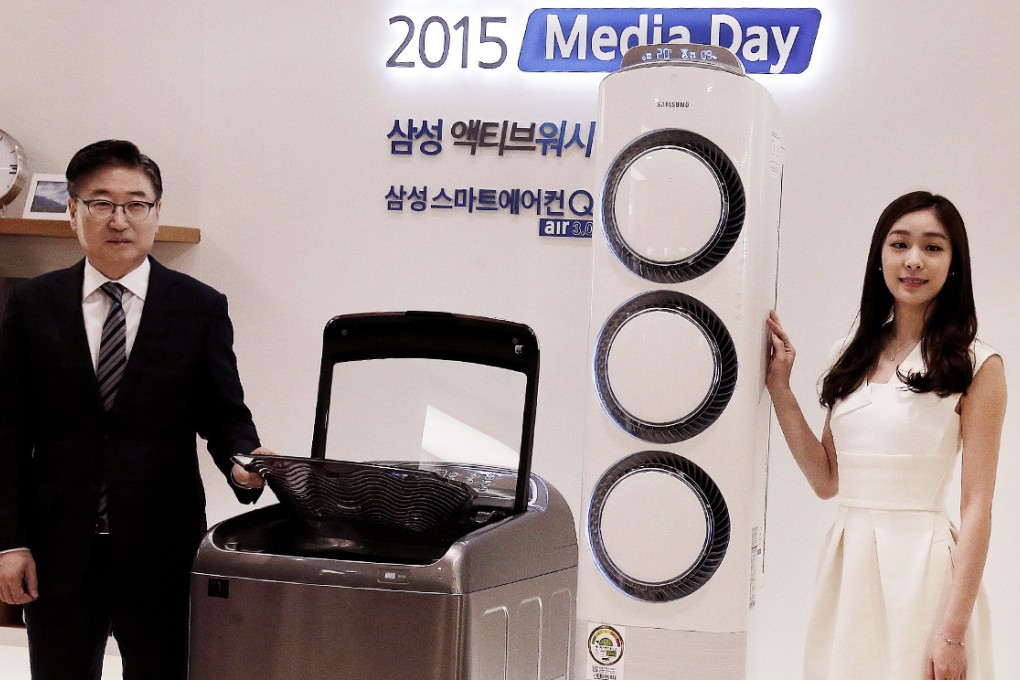 Samsung unveils a washing machine in this file photo. An LG executive was accused of tampering with Samsung washing machines at a trade fair. Photo: AP