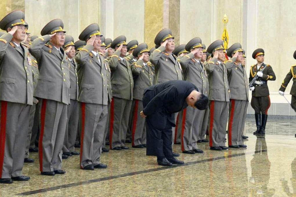 Kim Jong-un bows deeply to the embalmed corpse of his father at the Kumsusan Palace of the Sun in Pyongyang on Sunday. Photo: EPA