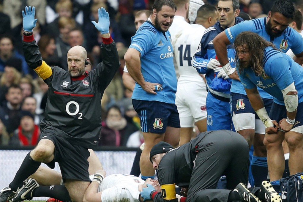 Medics call for a stretcher as England’s injured fullback Mike Brown lays motionless 12 minutes into Saturday’s Six Nations match against Italy. Photo: AP