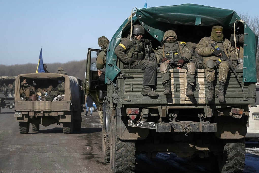A convoy of lorries carrying Ukrainian troops leave the area around Debaltseve. Photo: Reuters