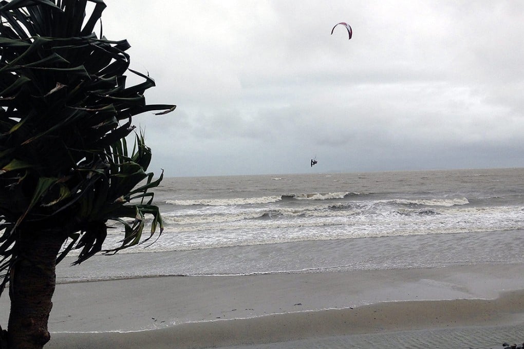 A kitesurfer makes the most of strong winds and choppy seas caused by Cyclone Marcia, near Yeppoon, central Queensland. Photo: EPA