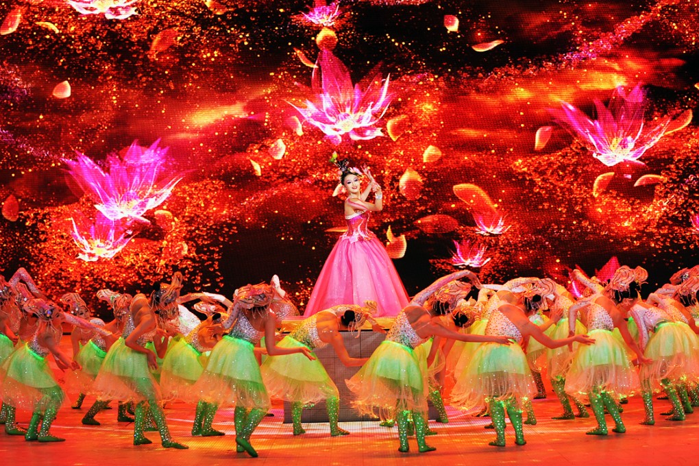 A scene from CCTV's annual New Year Gala, in this file photo. The glitzy, festive live broadcast this year featured a gam0e where viewers could use their smartphones to grab virtual red money envelopes. Photo: China Foto Press
