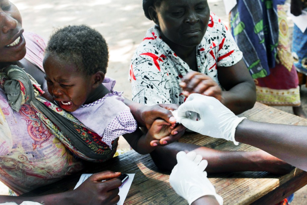 Malawians going through a medical checkup by a paramedic from a non-governmental organisation in Makhanga in the southern Malawian district of Nsanje. Photo: AFP
