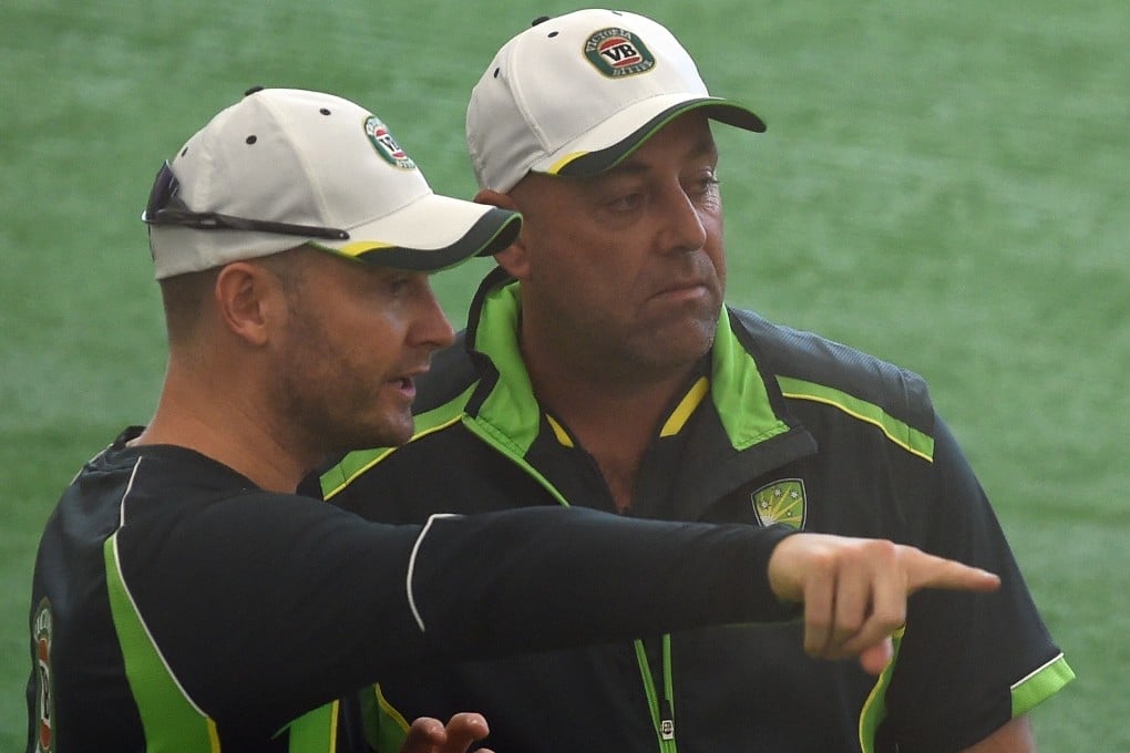 Australian captain Michael Clarke speaks with coach Darren Lehmann during an indoor training session ahead of their World Cup match against Bangladesh. Photo: AFP