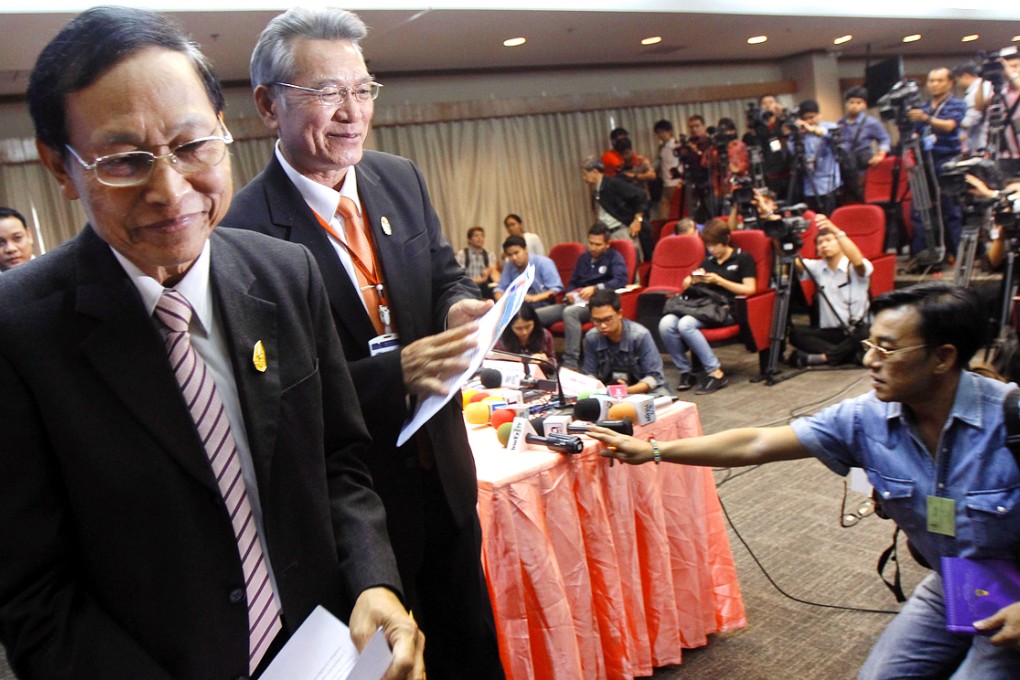 Thailand's Attorney Director General, Department of Special Litigation, Chutichai Sakhakorn and Director General, Department of Investigation, Surasak Threerattrakul attend a news conference in Bangkok. Photo: Reuters