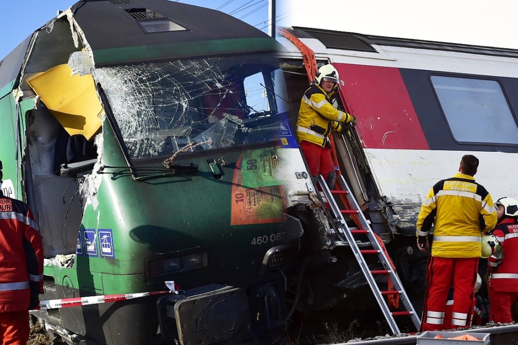 A rescue worker inspects the site of train crash at the train station of Rafz, northern Switzerland. Two trains slammed into each other north of Zurich, leaving dozens of passengers injured. Photo: AFP