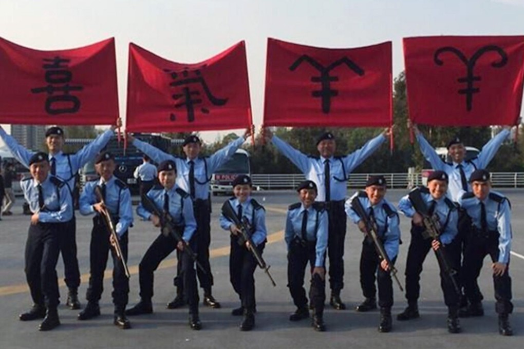 Police officers pose to mark the Year of the Goat. Photo: SMP