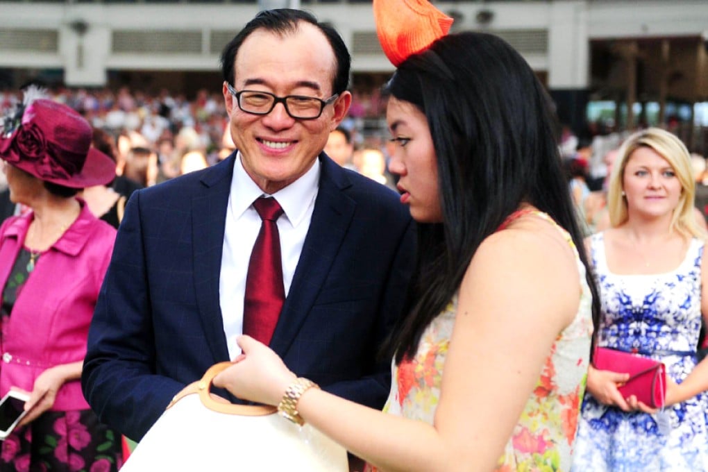 The head of the Tianjin-based China Horse Club, Teo Ah Khing, second left, at the Singapore meeting. Photo: AFP