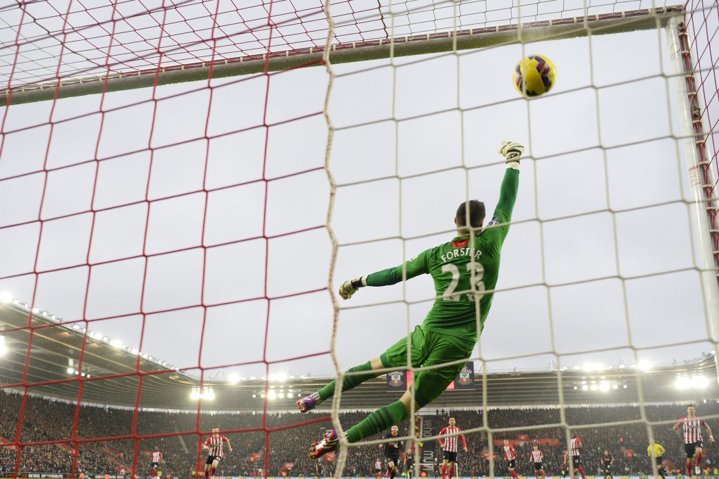 Philippe Coutinho beats Southampton keeper Fraser Forster to score the first goal for Liverpool. Photo: Reuters