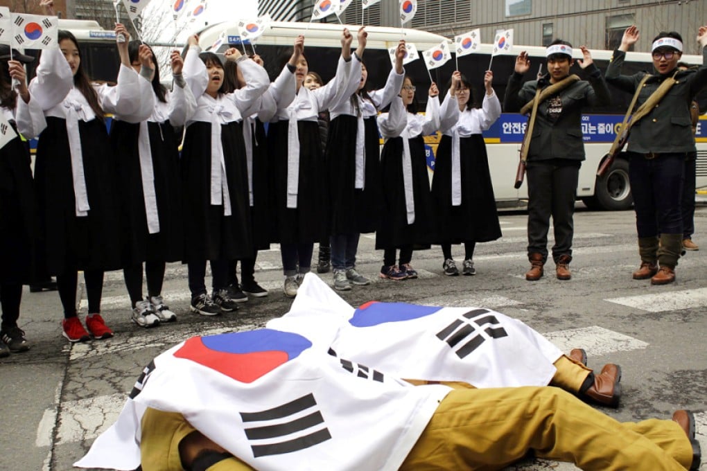 South Korean students perform during a rally against Japan's Takeshima Day in front of the Japanese embassy in Seoul. Photo: AP