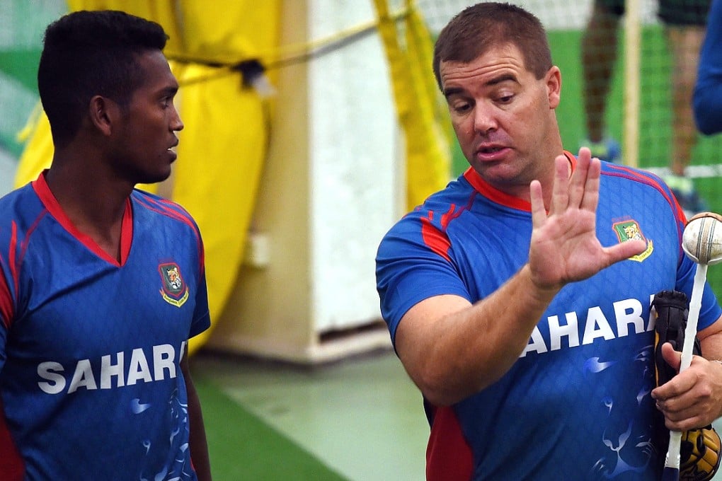 Al-Amin Hossain with bowling coach Heath Streak at the World Cup before he was sent home. Photo: AFP