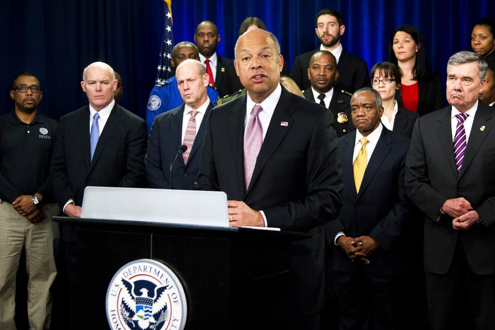 US Homeland Security Secretary Jeh Johnson, joined by the department employees, speaks during a news conference in Washington on Monday to discuss the need for Congress to pass a funding bill. Photo: AP