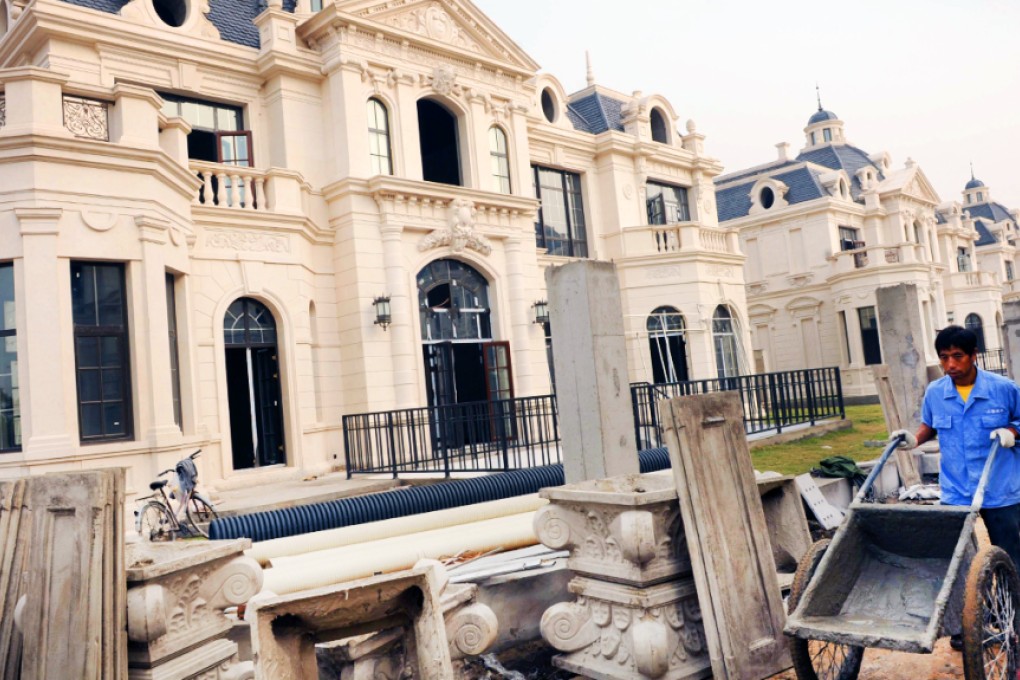 The volume of sales of luxury apartments in Shanghai worth more than 10 million yuan fell 34 per cent last year to 2,246 units from 2013. Photo: AFP