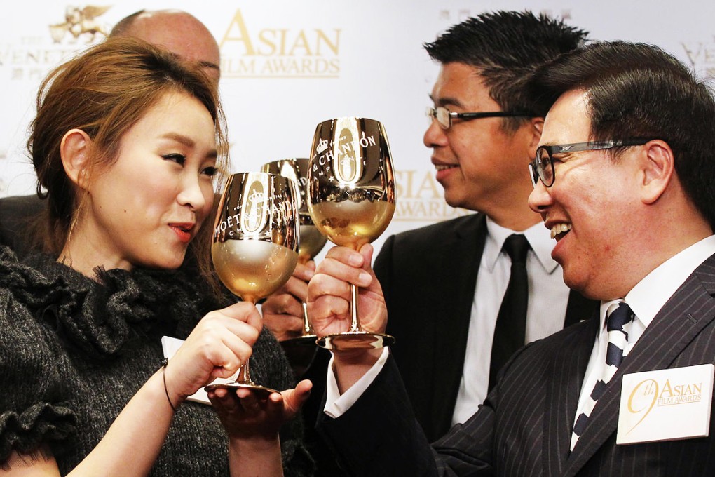 Ivana Wong raises a glass with Dr Wilfred Wong, of the Asian Film Awards Academy. Photo: Edward Wong