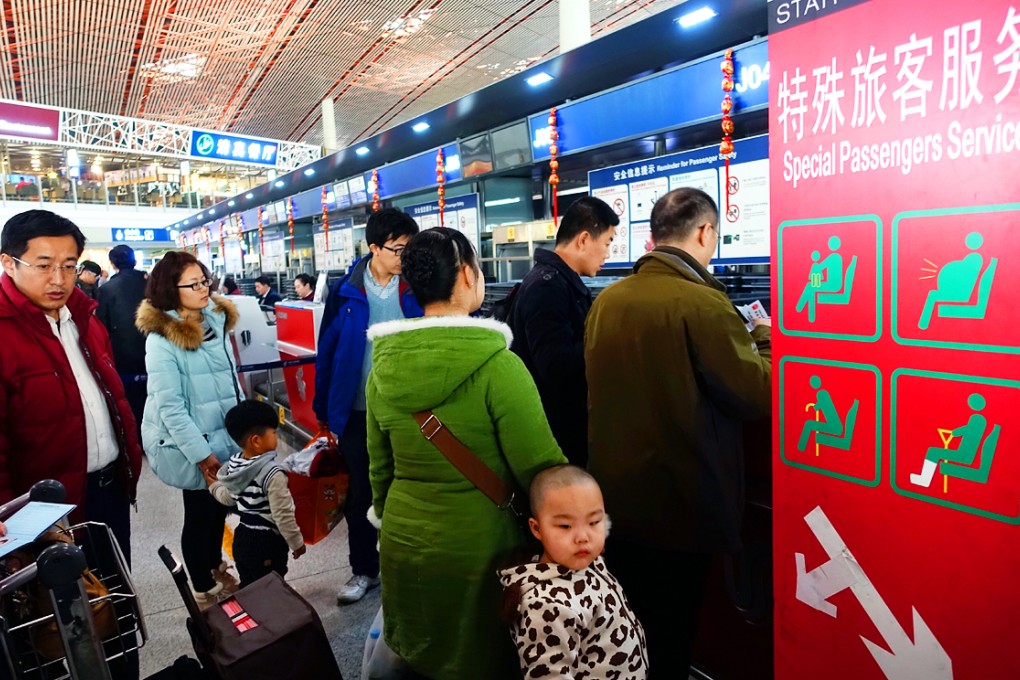 Passengers checking in at Beijing's international airport during the holiday. The numbers travelling to the United States and Australia also increased during the festive period, according to tour agencies. Photo: Xinhua