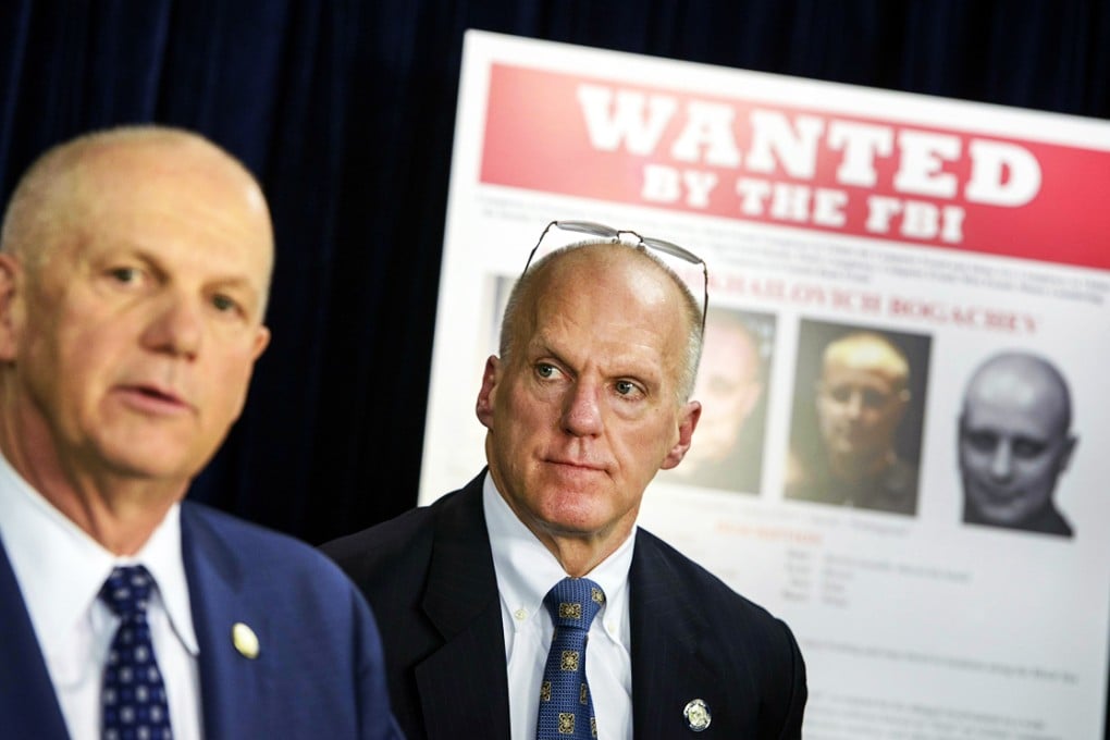 Federal Bureau of Investigation Assistant Director for Cyber Security Joseph Demarest (right) listens while US Attorney for the Western District of Pennsylvania David Hickton speaks during a briefing at the Foreign Press Center on February 24, 2015 in Washington, DC. Photo: AFP