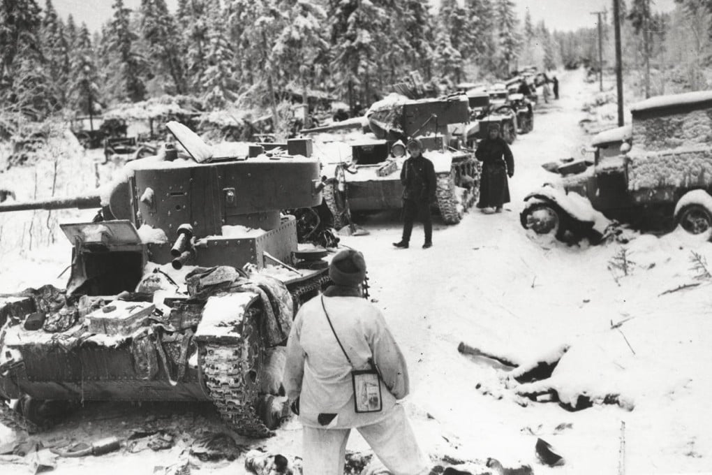 Finnish troops inspect destroyed Soviet vehicles in Finland, on January 17, 1940, during the winter war. Photos: US Library of Congress; Daniel Allen