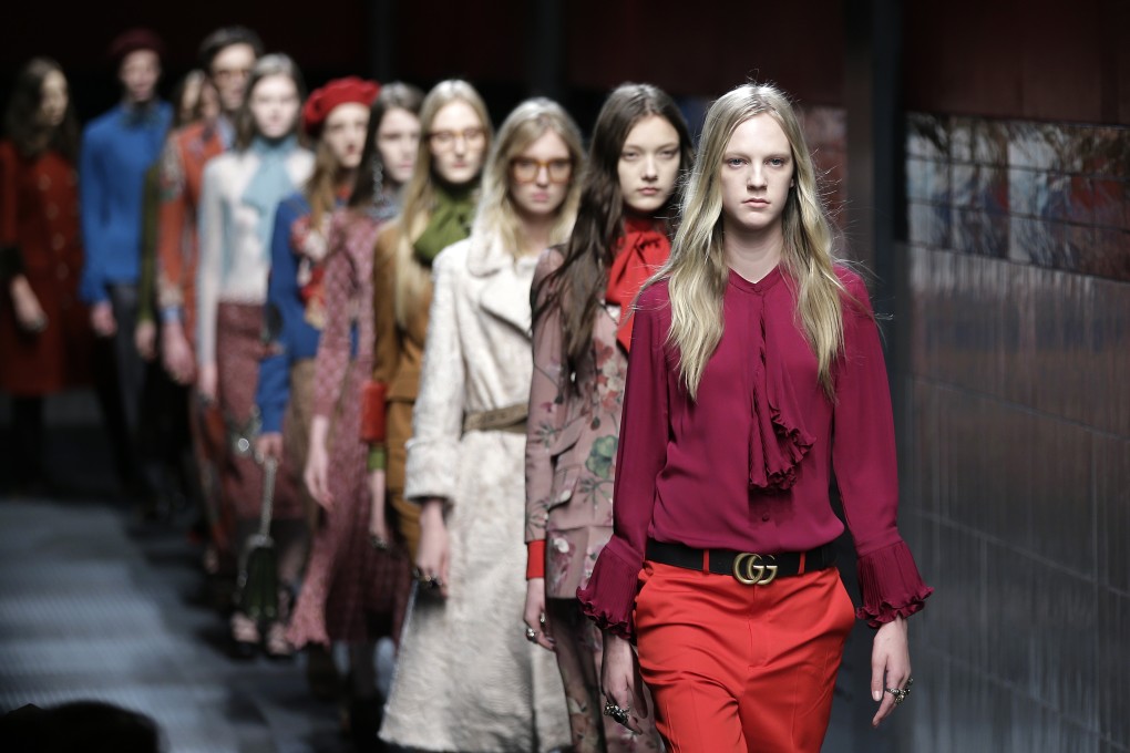 Models show Gucci women's autumn-winter 2015 creations as part of Milan Fashion Week. The double-G belt buckle made a comeback. Photo: AP