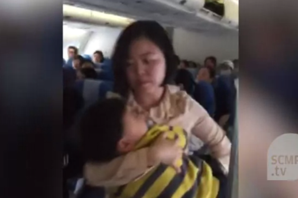 The mainland Chinese mother takes her child and leaves the cabin after a heated dispute with fellow passengers and crew.