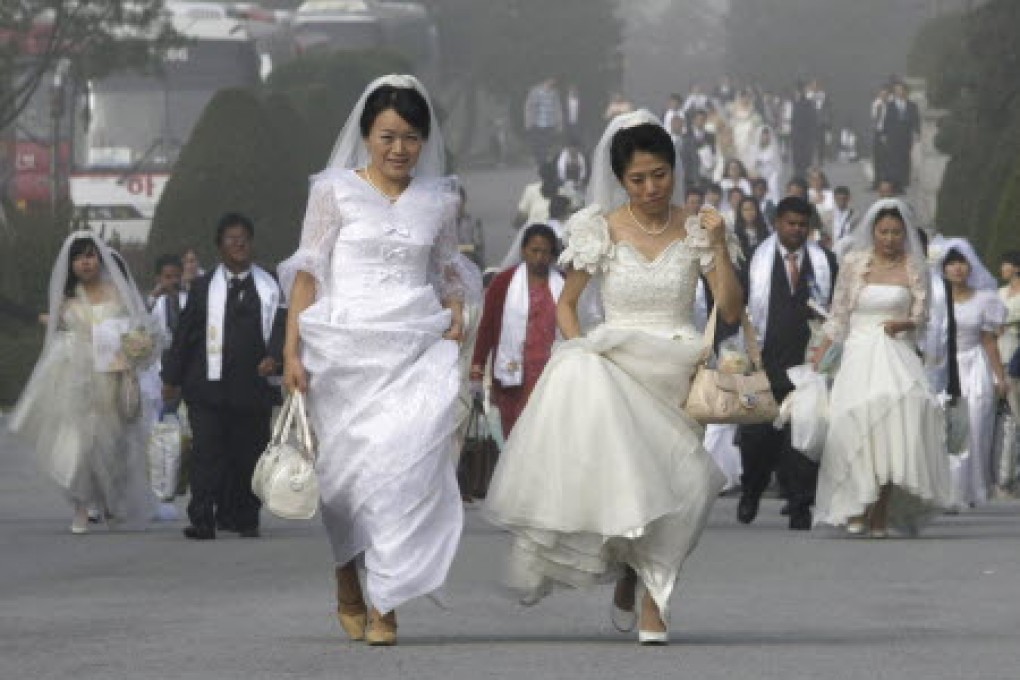 Brides head to a mass wedding in South Korea, in this file photo. The country's adultery statute was originally designed to protect the rights of women at a time when marriage afforded them few legal rights. Photo: AP