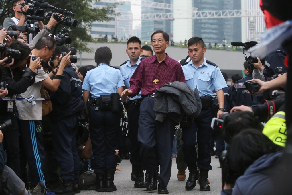 Police officers take away Martin Lee Chu-ming as the Occupy protest site at Admiralty was cleared last December. Photo: Sam Tsang