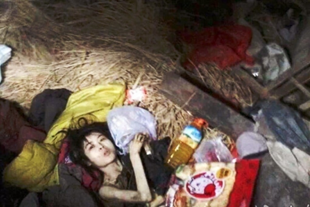 Zhang Qi, 24, lies inside the room where she had been locked for five years by her Chinese family in Xiaochang county, Hubei province. Photo: cnhubei.com