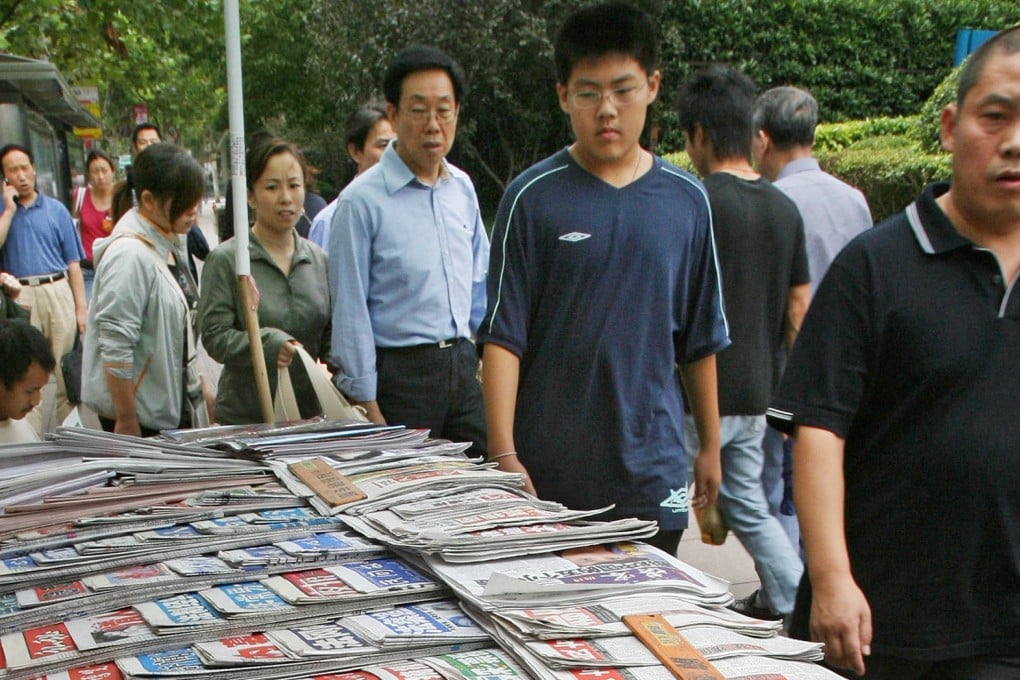 Newspapers compete for attention at a news stand in Shanghai. Photo: AFP