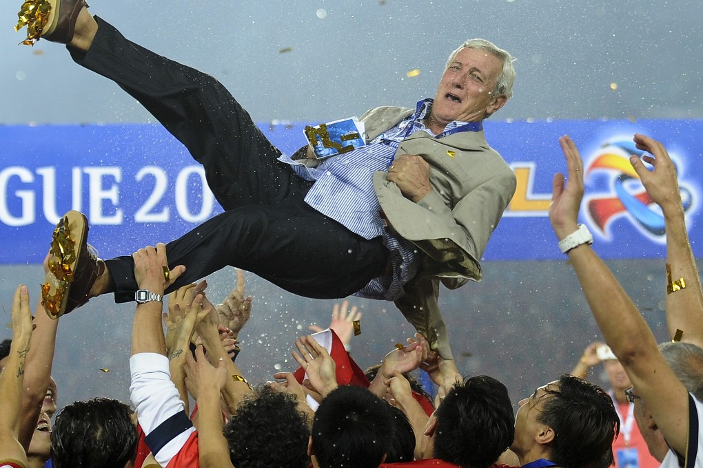 Marcello Lippi is thrown into the air by his players as Guangzhou Evergrande celebrate beating South Korea's FC Seoul in the 2013 Asian Champions League final. Photo: AP