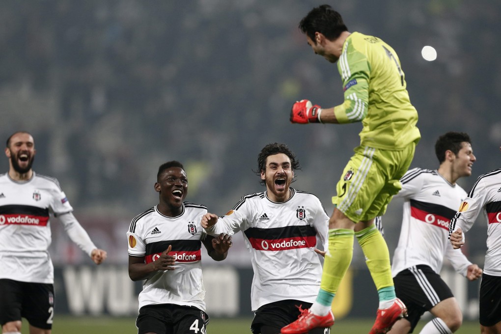 Besiktas players celebrate winning on penalties against Liverpool. Photo: EPA