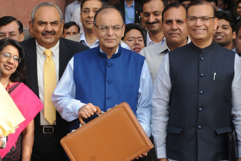 India's Finance Minister Arun Jaitley (centre) holds a briefcase containing budget documents on Saturday. Photo: EPA