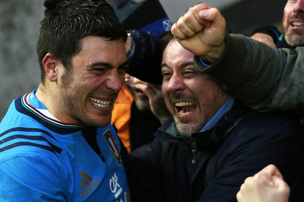 Italy scrum-half Edoardo Gori celebrates with fans at full-time in their Six Nations win against Scotland. Photo: AFP