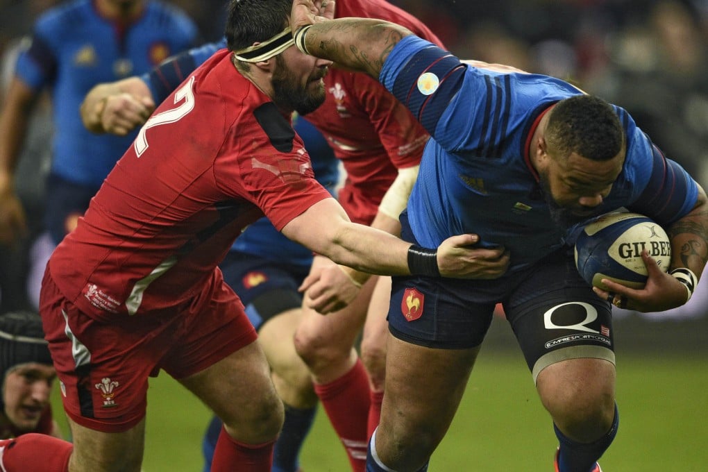 France's Mathieu Bastareaud evades a tackle by Scott Baldwin of Wales. Photo: AFP