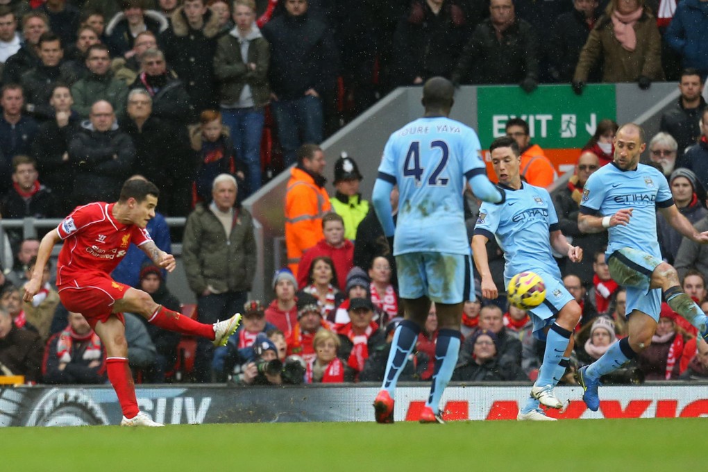 Brazilian midfielder Philippe Coutinho curls home a fine strike to seal a vital Premier League win for Liverpool. Photo: Reuters