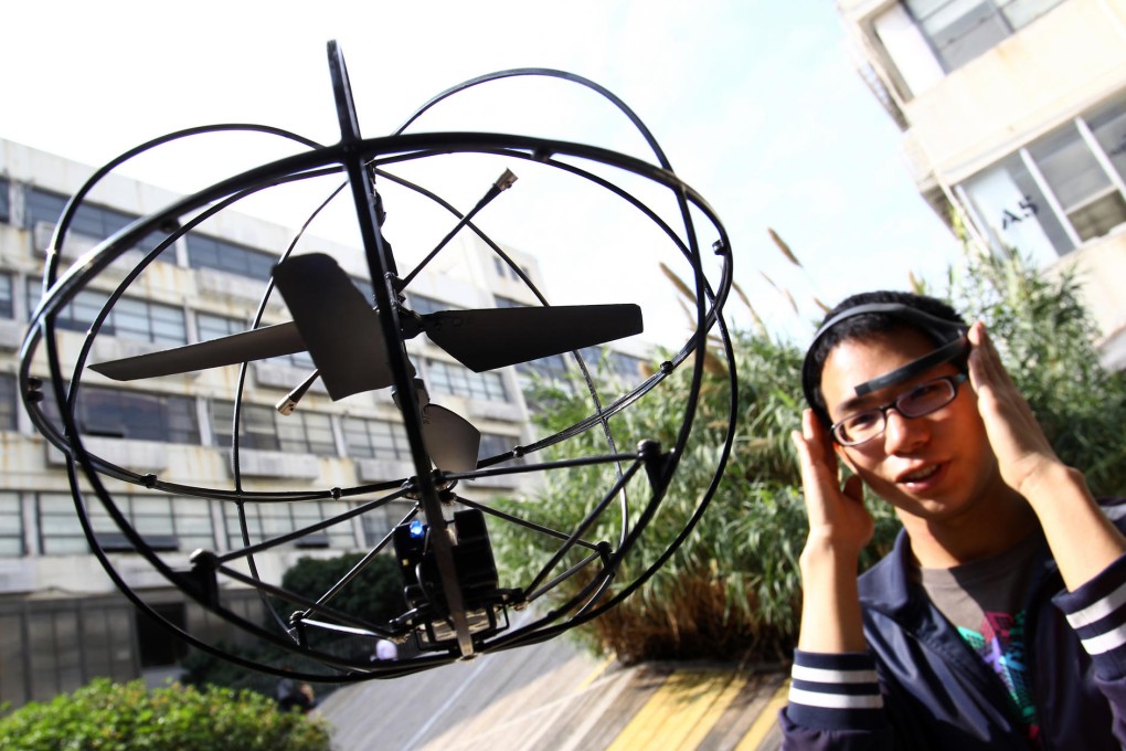 Sam Chen steers a "brain-controlled" Puzzlebox Orbit helicopter outside the Chaihuo maker space, a Shenzhen workshop for technology enthusiasts. Photo: Dickson Lee