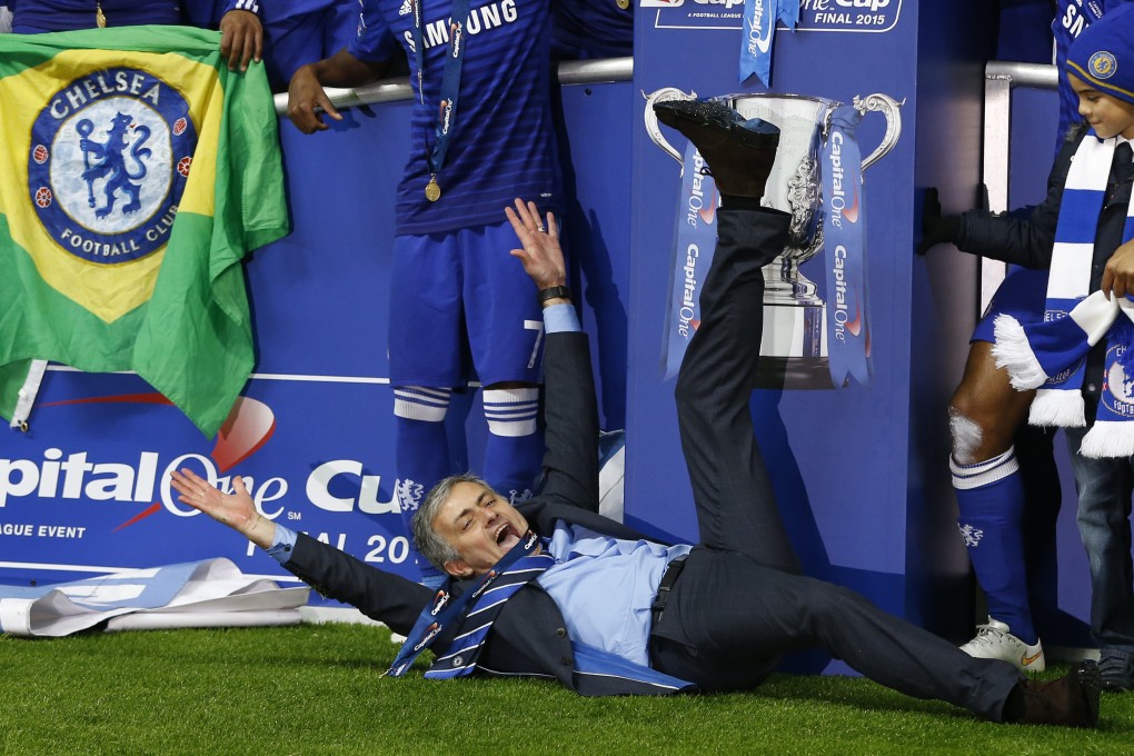 Jose Mourinho gets down and dirty as he celebrates Chelsea's League Cup victory. Photo: AP