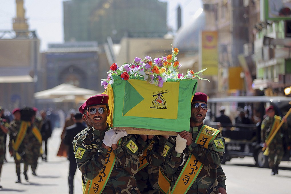 Iraqi fighters carry the coffin of their comrade who was killed in Tikrit fighting Islamic militants. Iraqi security forces began a large-scale military operation to recapture Tikrit from Islamic State extremists. Photo: Reuters