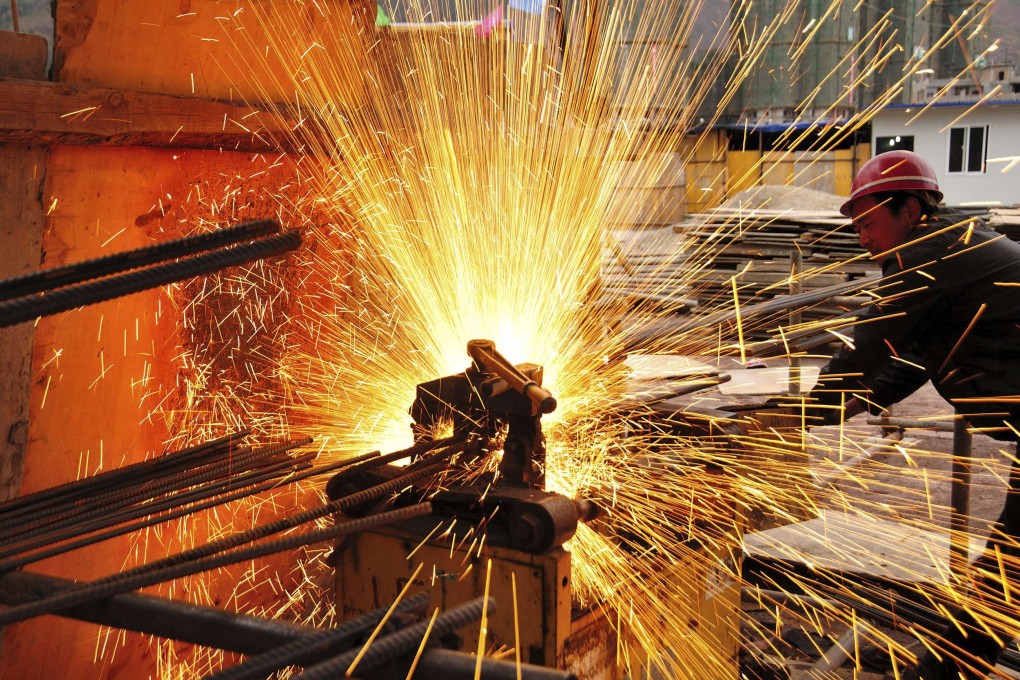 A worker welding at a construction site in Yunnan province in China. Activity in the country's factory sector hit a 7-month high in February. Photo: Reuters