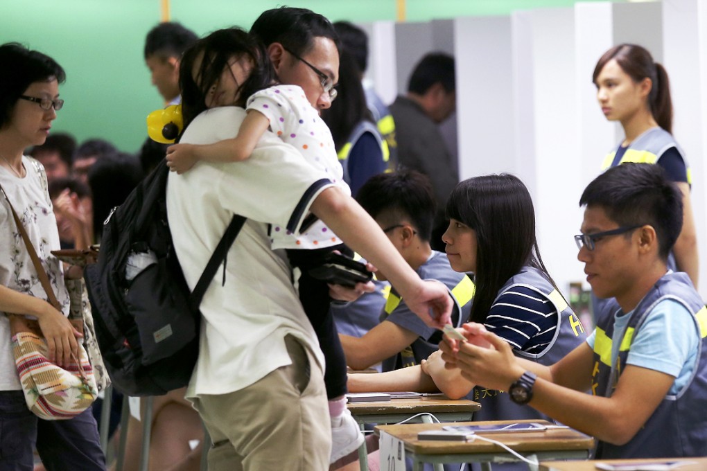 A file photo taken in June, 2014 shows people vote in unofficial referendum on political reform at Hong Kong Professional Teachers' Union in Causeway Bay. Photo: K.Y. Cheng