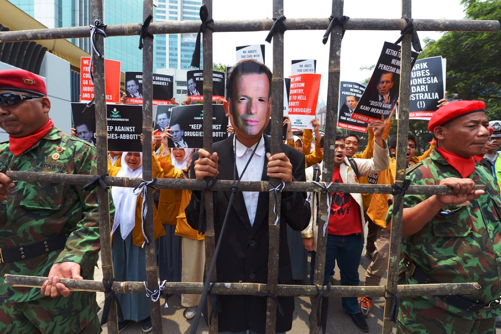 Indonesian students rally against Australia's Prime Minister Tony Abbott following his statement over the tsunami aid from Australian government outside the Australian embassy in Jakarta. Photo: AFP