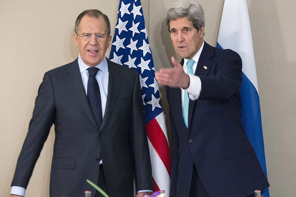 US Secretary of State John Kerry gestures next to Russian Foreign Minister Sergei Lavrov during their meeting in Geneva. Photo: Reuters