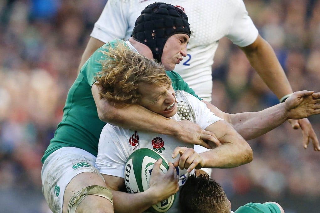 England's Billy Twelvetrees is tackled by Ireland's Tommy O'Donnell. Photo: Reuters