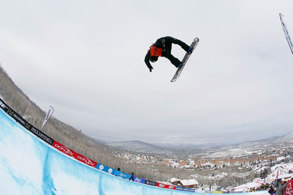 Zhang Yiwei in action during the snowboard halfpipe final  at Park City. Photo: AFP