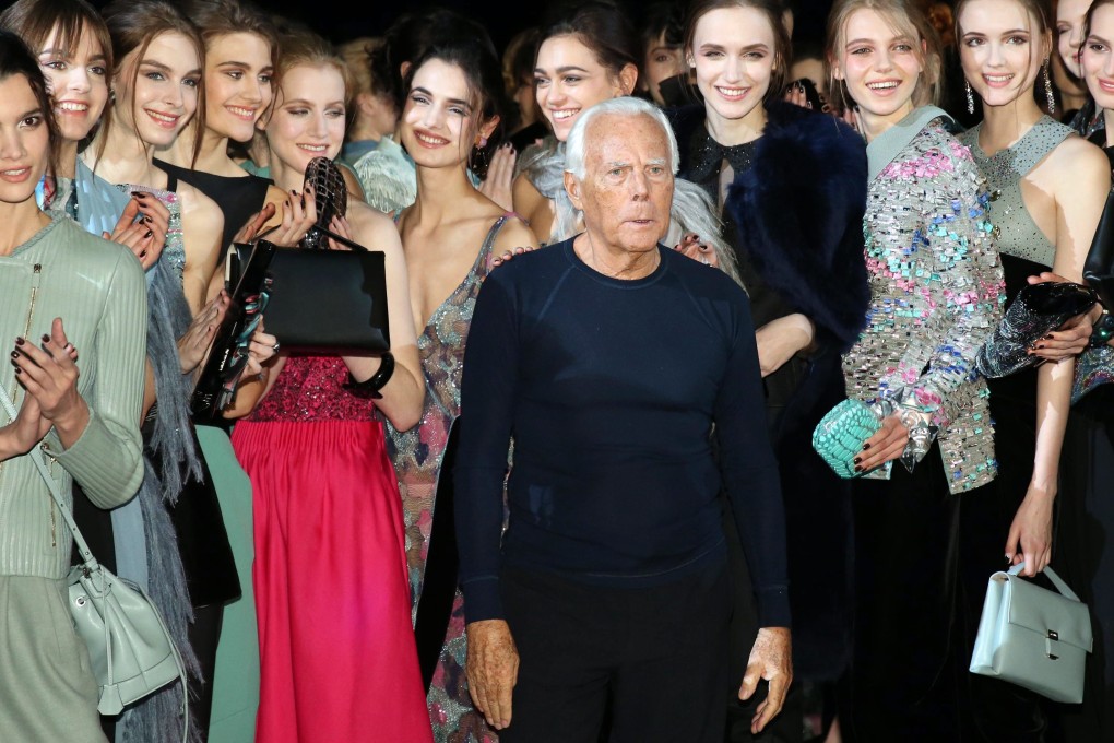 Designer Giorgio Armani with models presenting his autumn/winter 2015 collection in Milan. Photo: EPA