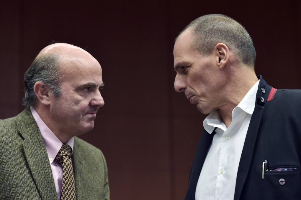 Spain's Finance Minister Luis de Guindos (left) chats with Greece's Finance Minister Yanis Varoufakis. De Guindos declared a new bailout for Greece, only to backtrack hours later after denials from European officials. Photo: Reuters