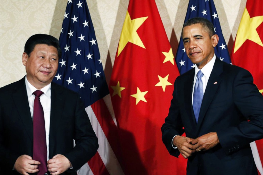 President Xi meets President Obama last year. Obama has criticised China's new tech rules. Photo: Reuters