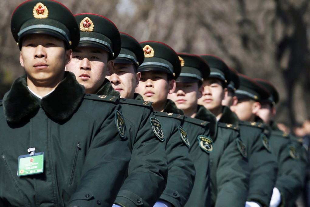PLA soldiers march ahead of the opening session of the Chinese People's Political Consultative Conference at Tiananmen Square in Beijing on Tuesday. Photo: Reuters